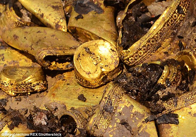Gold plates and coins among valuable haul unearthed by archaeologists at 2,000-year-old royal tombs in China 