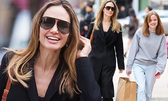 Angelina Jolie exudes class in a stylish black coat with lookalike daughter Vivienne, 15, while shopping in NYC... after accusing Brad Pitt of more abuse | Daily Mail Online