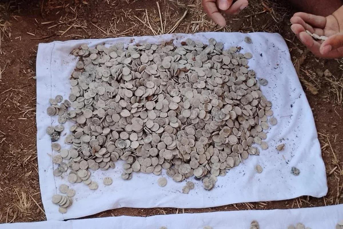 Earthen pot containing 3,730 lead coins from Ikshvaku period unearthed in Phanigiri, India.