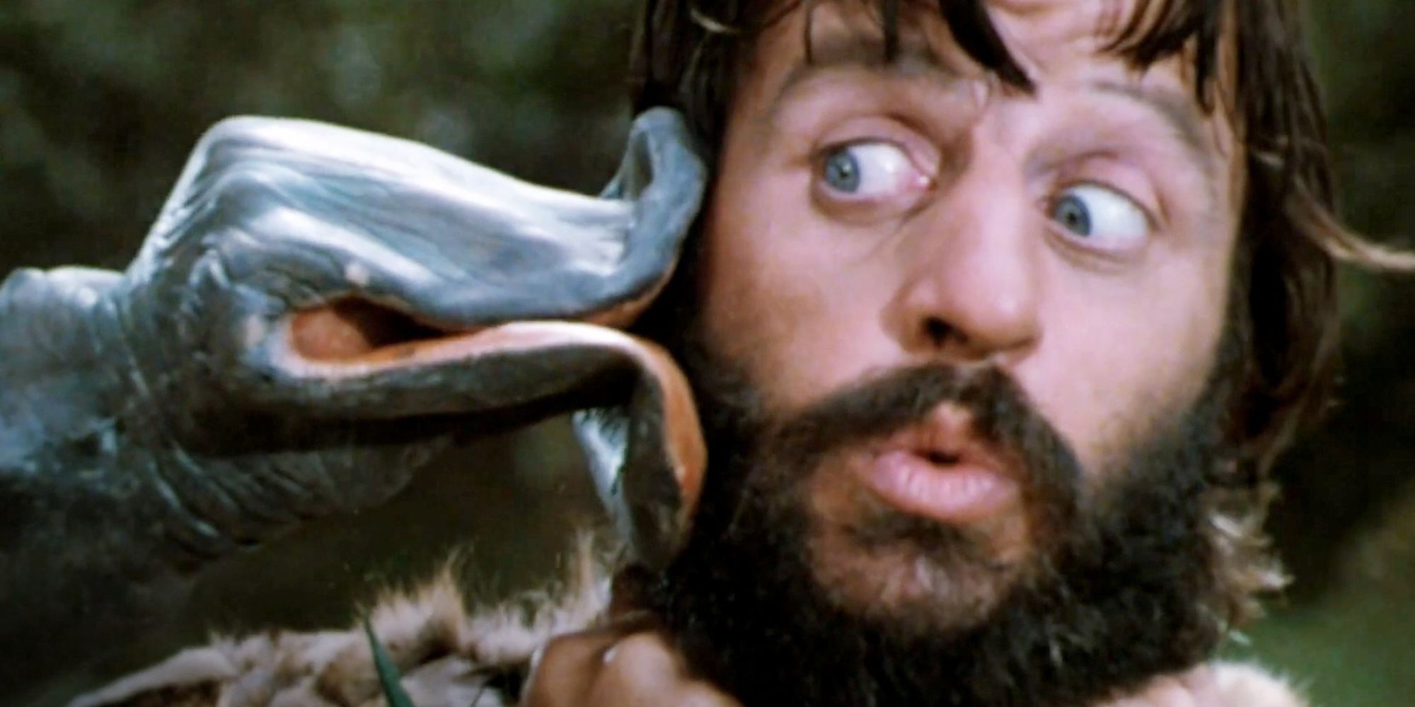 You Probably Had No Idea That This Music Icon Starred In A Must-Watch 1980s Dinosaur Movie