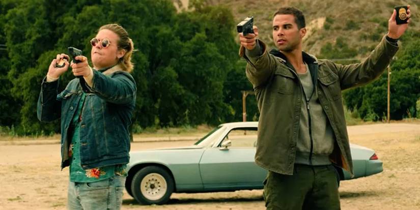 Under Fire Review: This Run-Of-The-Mill Buddy Cop Actioner Is Elevated By Dylan Sprouse & Mason Gooding’s Incredible Chemistry